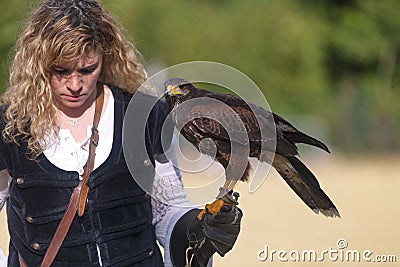 Medieval falconer with her falcon Editorial Stock Photo